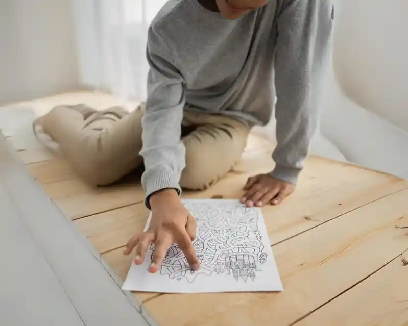 Boy working on reading worksheet